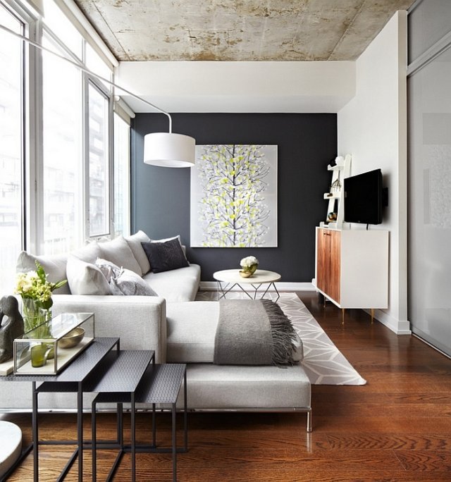 salon akcent ścienny czarna jasnoszara sofa narożna salon-ścienna akcentująca-czarna-jasno-szara-sofa narożna