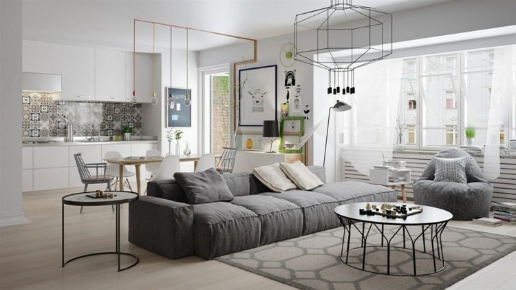 Mieszkanie z nowoczesnymi metalowymi akcentami design-apartament-ciemno-szara-kanapa-salon-meble-monochromatyczne-metalowe