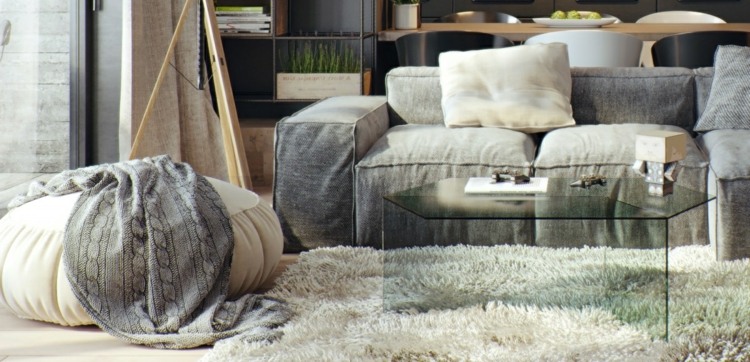 Projekt ze szklanym stolikiem jest tutaj prawie niezauważalny design-apartament-szklany-stół-sześciokąt-pufa-zielona-pastelowa-szary