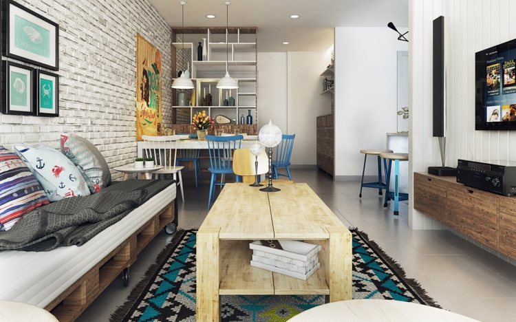 Ogrzej mieszkania dzięki naturalnym drewnianym meblom design-apartament-morski-nordic-niebieski-akcenty-jasne-drewno-stolik-paleta-sofa