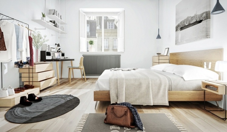Mieszkanie posiada dużą sypialnię design-apartament-prosty-styl-dywaniki-łóżko-owalne-drewno-biała-pościel